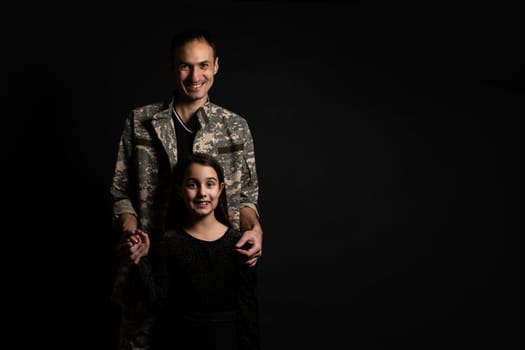 Masculine sad military man hugging her upset daughter indoors.