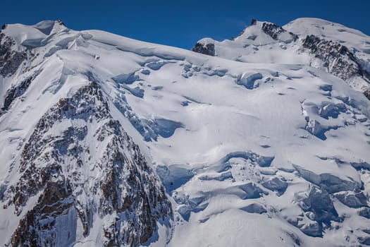 Mont blanc peak and massif, mountain climbing above glaciers, French Alps, France