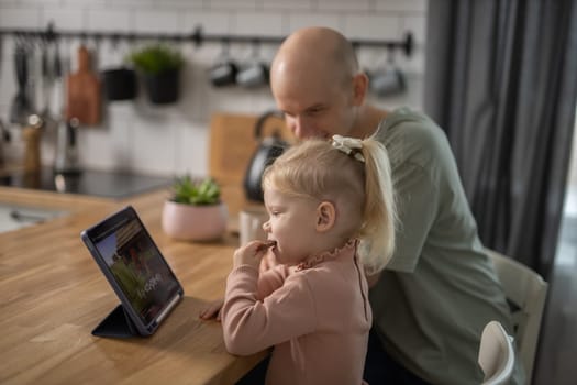 Deaf child girl with cochlear implant studying to hear sounds - recovery after cochlear Implant surgery and rehabilitation