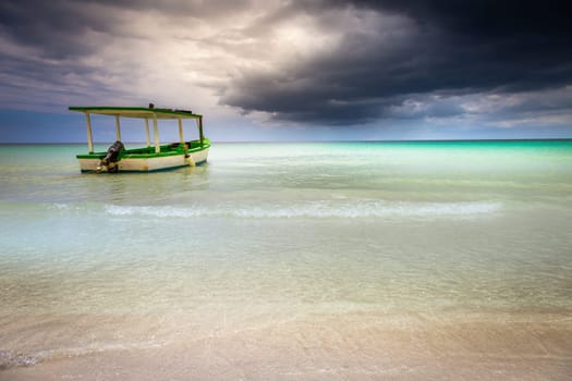 Tropical caribbean beach with storm clouds in idyllic Montego Bay, Jamaica