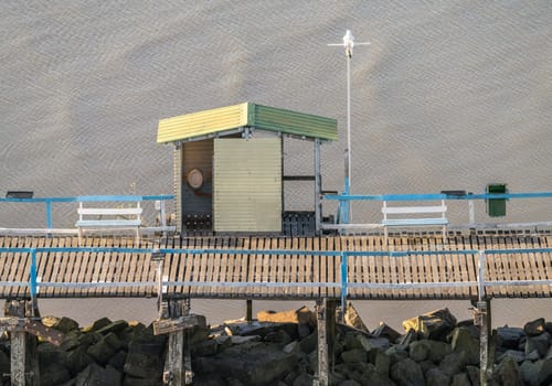 Pier in the entrance to Buenos Aires harbor with male urinal in open shed