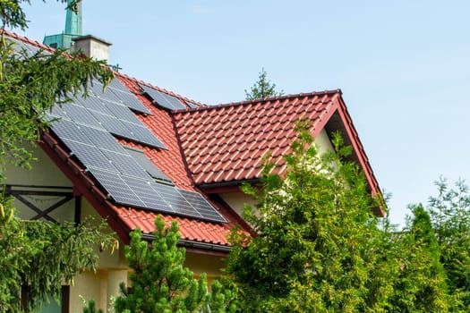 Historic farm house with modern solar panels on roof and wall High quality photo