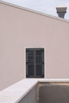 exterior view of a window in the facade of a house