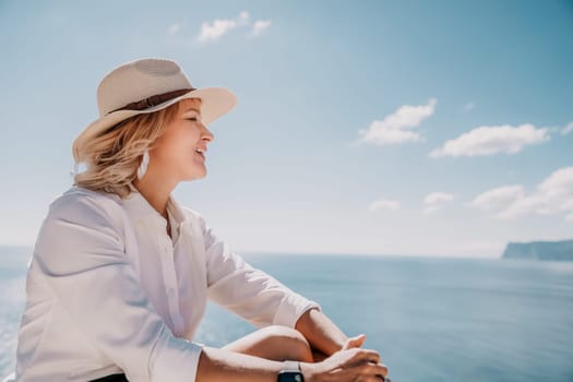 Happy girl doing yoga with laptop working at the beach. beautiful and calm business woman sitting with a laptop in a summer cafe in the lotus position meditating and relaxing. freelance girl remote work beach paradise