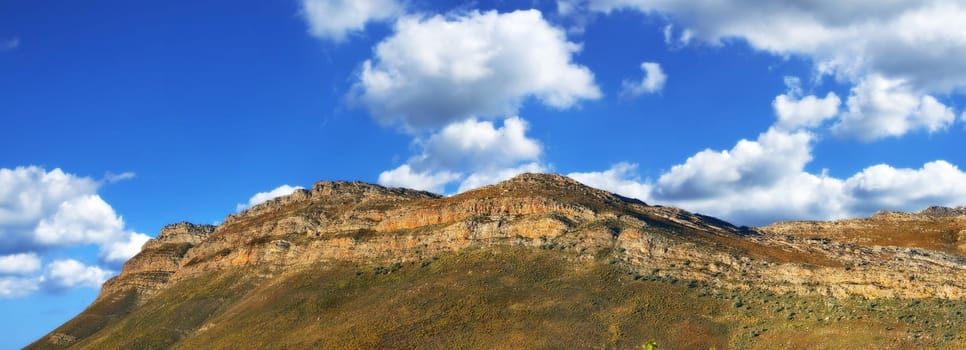 Scenic mountain range beneath picturesque cloudscapes. [Western Cape]