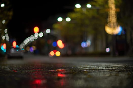 Blurred footage of transport. Blur of city lights along the road, light out of focus at night. Night city traffic, beautiful background