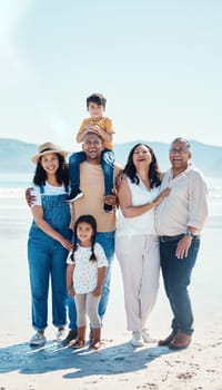 Portrait, beach and black family laughing outdoor in nature together on vacation during summer. Happy, smile or love with children, parents and grandparents bonding on the coast for a holiday.
