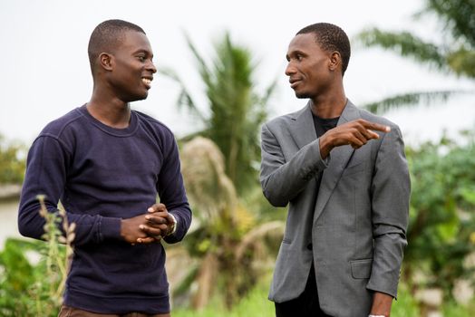 two young business people talking together outside boogie after work