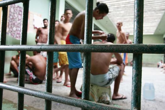 teixeira de freitas, bahia, brazil - november 24, 2009: detainees are seen in jail cells of the police complex in the city of teixeira de freitas.