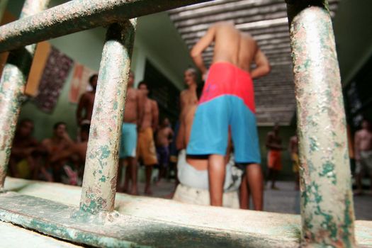teixeira de freitas, bahia, brazil - november 24, 2009: detainees are seen in jail cells of the police complex in the city of teixeira de freitas.
