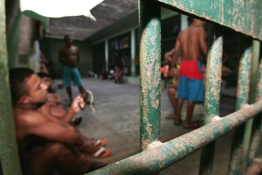 teixeira de freitas, bahia, brazil - november 24, 2009: detainees are seen in jail cells of the police complex in the city of teixeira de freitas.