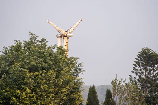 Old damaged windmill wind turbine placed at sukhna lake chandigarh showing use of renewable energy to pump water in the past now replaced by better technology