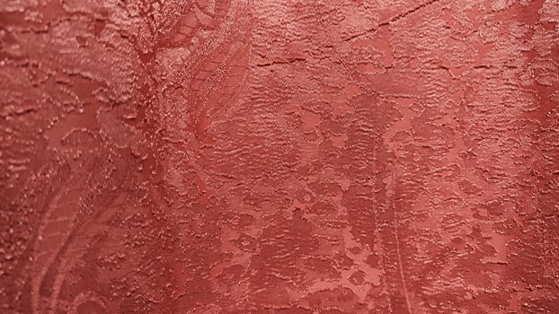 Red fabric with abstract texture for background, close-up. Small pattern on curtain