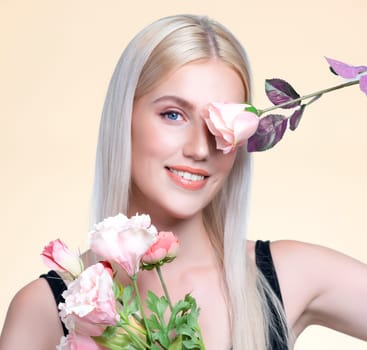 Closeup young personable woman with natural makeup and healthy soft skin holding rose for beauty care advertising in isolated background. Beautiful pretty model girl with flower concept.