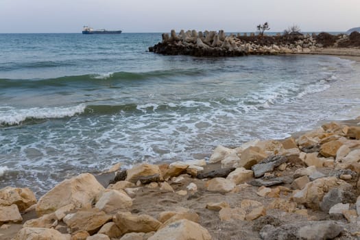 The beautiful coast of the city of Varna in Bulgaria. The sea beats against the stones, amazing seascape.