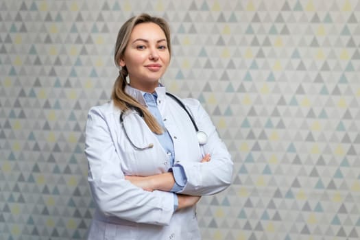 Photo of attractive family female doctor consulting patients beaming friendly smiling, white lab coat and stethoscope.