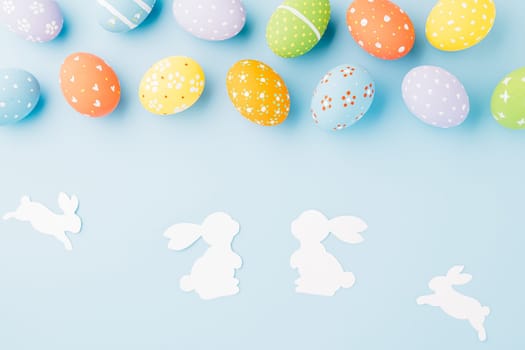 Easter eggs bunny and rabbit white paper cut isolated on blue background copy space, Funny decoration, Creative composition banner web design holiday background, Happy Easter Day, flat lay top view