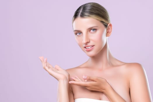 Alluring beautiful woman with perfect smooth and clean skin portrait in isolated background. Beauty hand gesture with expressive facial expression for skincare treatment product or spa.