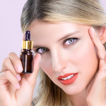 Closeup alluring portrait of beautiful woman in isolated holding extracted cannabis oil bottle for skincare product. Cannabis and CBD oil pipette for facial treatment cosmetology and beauty concept.