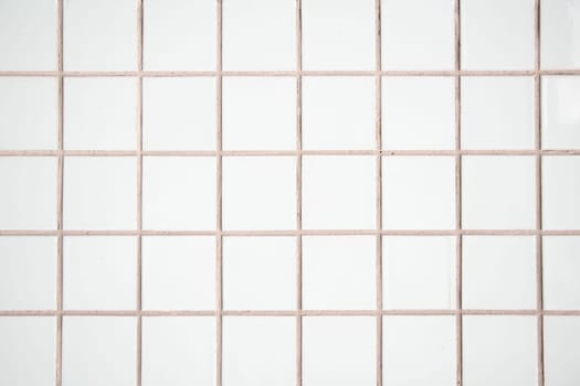 white tile wall, abstract pattern mosaic background, textured wall or floor in bathroom, Space For Text. High quality photo