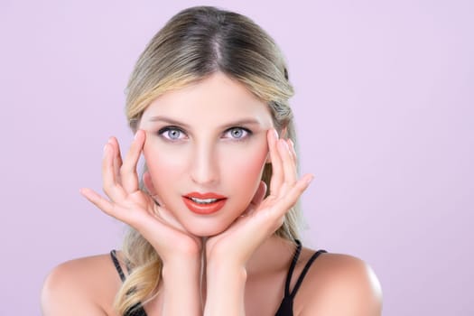 Closeup pretty beautiful woman with alluring perfect smooth and clean skin portrait in pink isolated background. Hand gesture with expressive facial expression for beauty model concept.