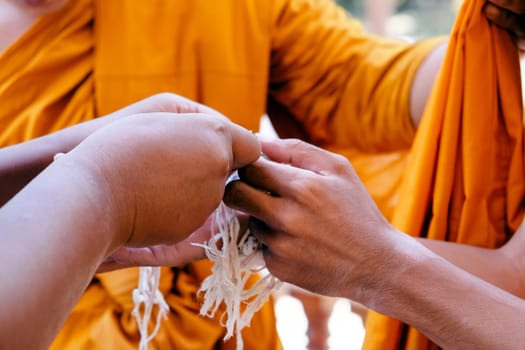 Image of ordination ceremony in buddhism, ceremonial thread