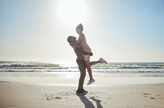 Couple, bonding or hug on beach date by water waves, sea or Bali ocean in romance holiday, anniversary vacation or proposal celebration. Smile, happy or fun black woman and man love bonding in nature.