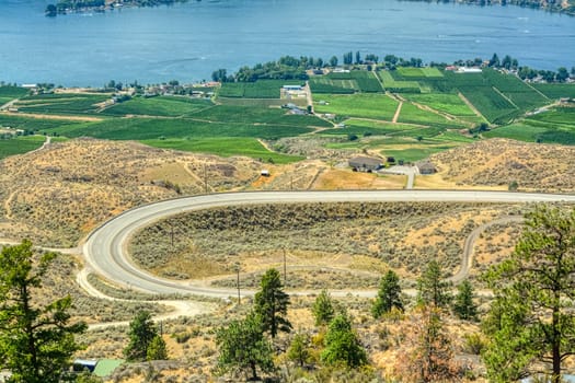 C-shaped road in Okanagan valley on hot summer day in British Columbia