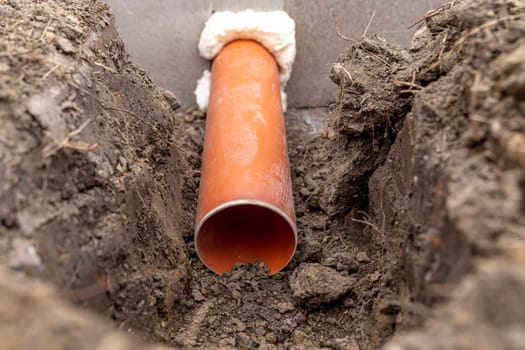 plastic pipe for sewage network in the base plate at the construction site.