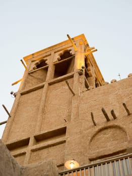 Narrow streets that create shade on a hot day in the old city of Dubai Creek and Bur district. Travel destinations and heritage village.