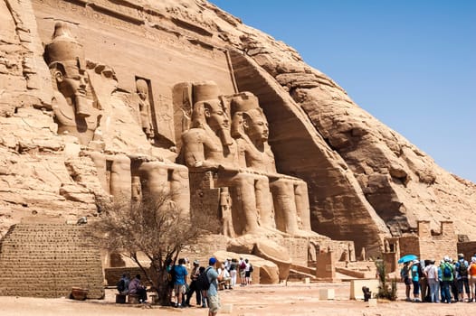 Abu Simbel, Aswan, Egypt - April 18 2008: Tourists visiting the archaeological site of Abu Simbel, Aswan, Egypt