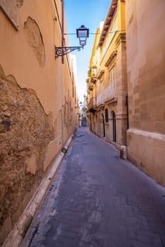 Typical Small street on the Island of Ortigia, Syracuse in Sicily, Italy	