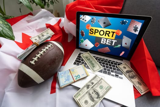 laptop with sports betting and canada flag.