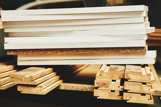 a type of strong thin wooden board consisting of two or more layers glued and pressed together with the direction of the grain alternating