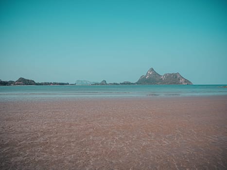 horizon scenics Calm sea beach with blue water ocean  on mountain nature background.