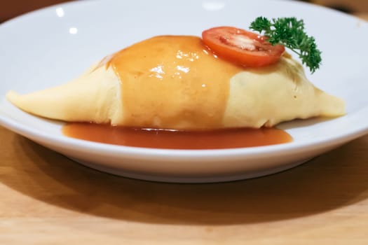 Omurice is a Japanese food that uses eggs to wrap rice.