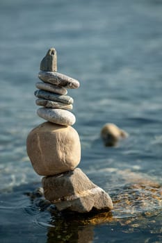 balanced stones on the rocks of the sea