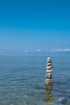 balanced stones on the rocks of the sea