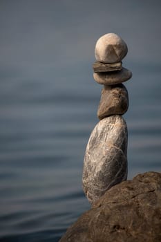 balanced stones on the rocks of the sea