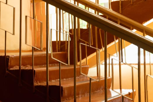 The old staircase at the school steps and railings. Transition from one floor to another.