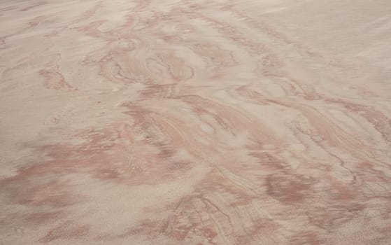 Different colors and shades in a sandy beach on Falkland Islands