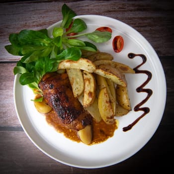 Recipe for boneless rolled chicken leg with potatoes and molasses-flavoured mache salad, High quality photo