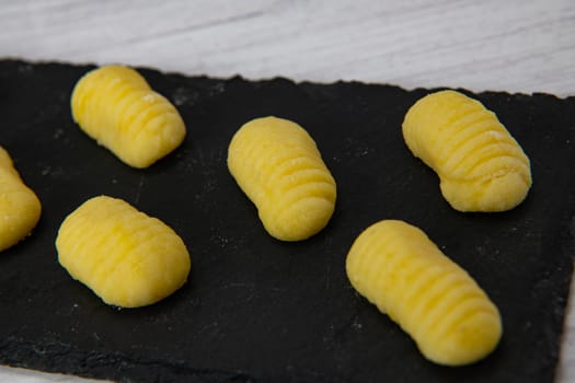 Pile of yellow eggs gnocchi Gnocci potato peru italian food, High quality photo