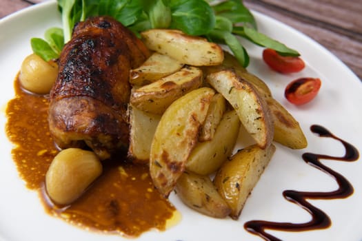Recipe for boneless rolled chicken leg with potatoes and molasses-flavoured mache salad, High quality photo
