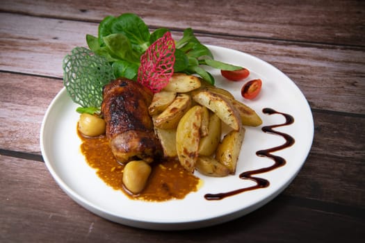 Recipe for boneless rolled chicken leg with potatoes and molasses-flavoured mache salad, High quality photo