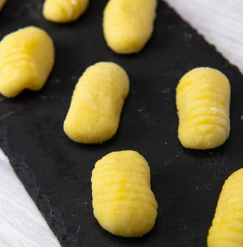 Pile of yellow eggs gnocchi Gnocci potato peru italian food, High quality photo