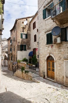 Colorful street in the old town of Kotor on a sunny day, Montenegro. Travel, vacation, walk