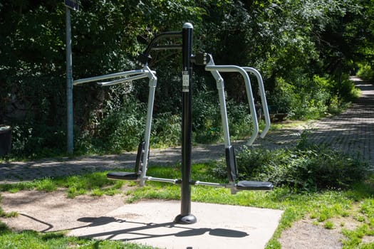 Exercise machines and fitness equipment in the street outdoor gym in city park, High quality photo