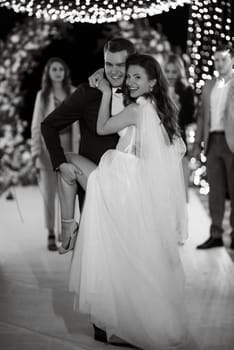 newlyweds at a wedding in the corridor of sparklers