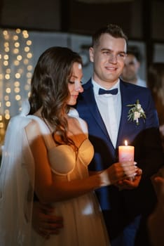 ceremony of passing the wedding fire from parents to children with lighting candles